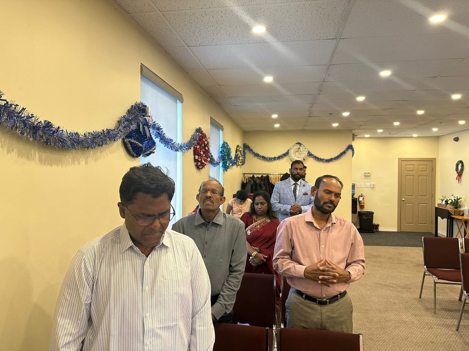 Church family gathered in prayer